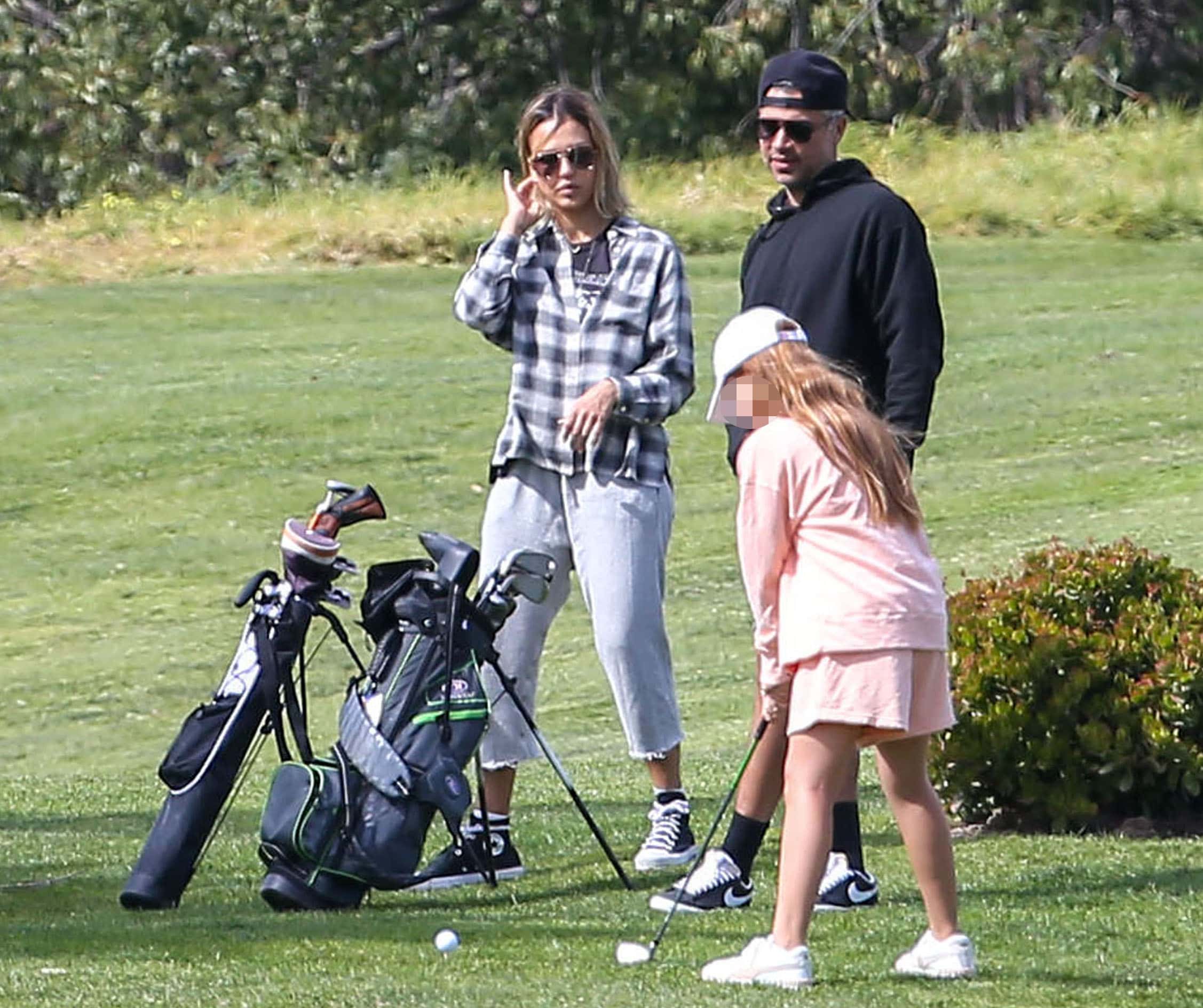 Jessica Alba plays golf with husband Cash Warren and kids on February 26, 2022