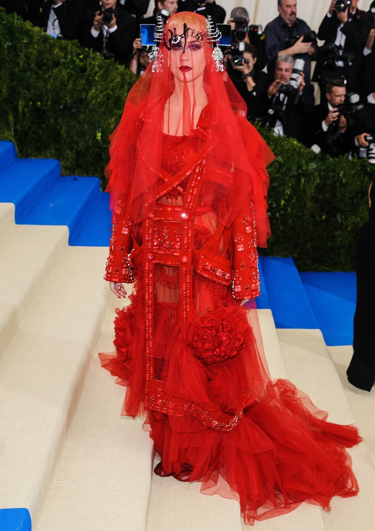 Katy Perry in a red Maison Margiela Spring 2017 Couture design attends the 'Rei Kawakubo / Comme des Garcons: Art Of The In-Between' Costume Institute Gala 2017