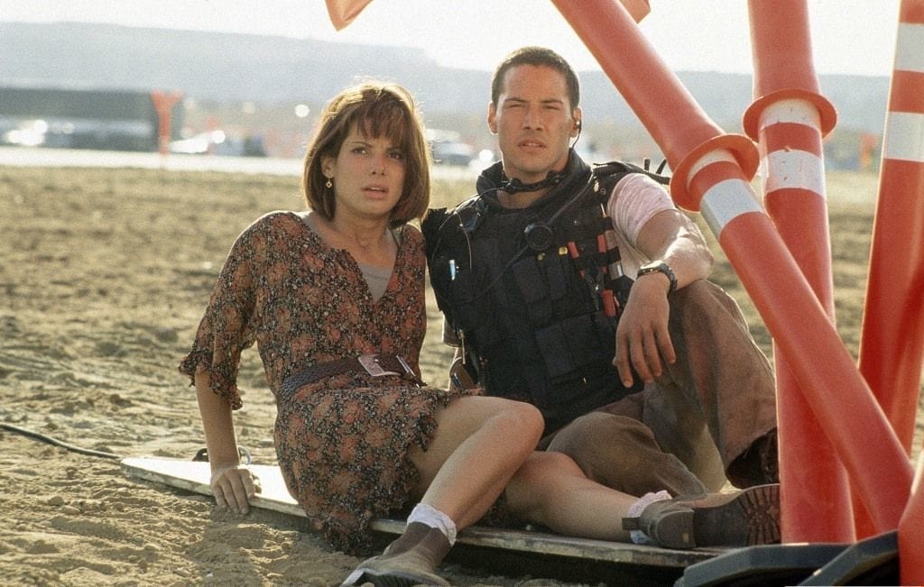 Keanu Reeves as Officer Jack Traven and Sandra Bullock as Annie Porter in the 1994 smash-hit blockbuster Speed