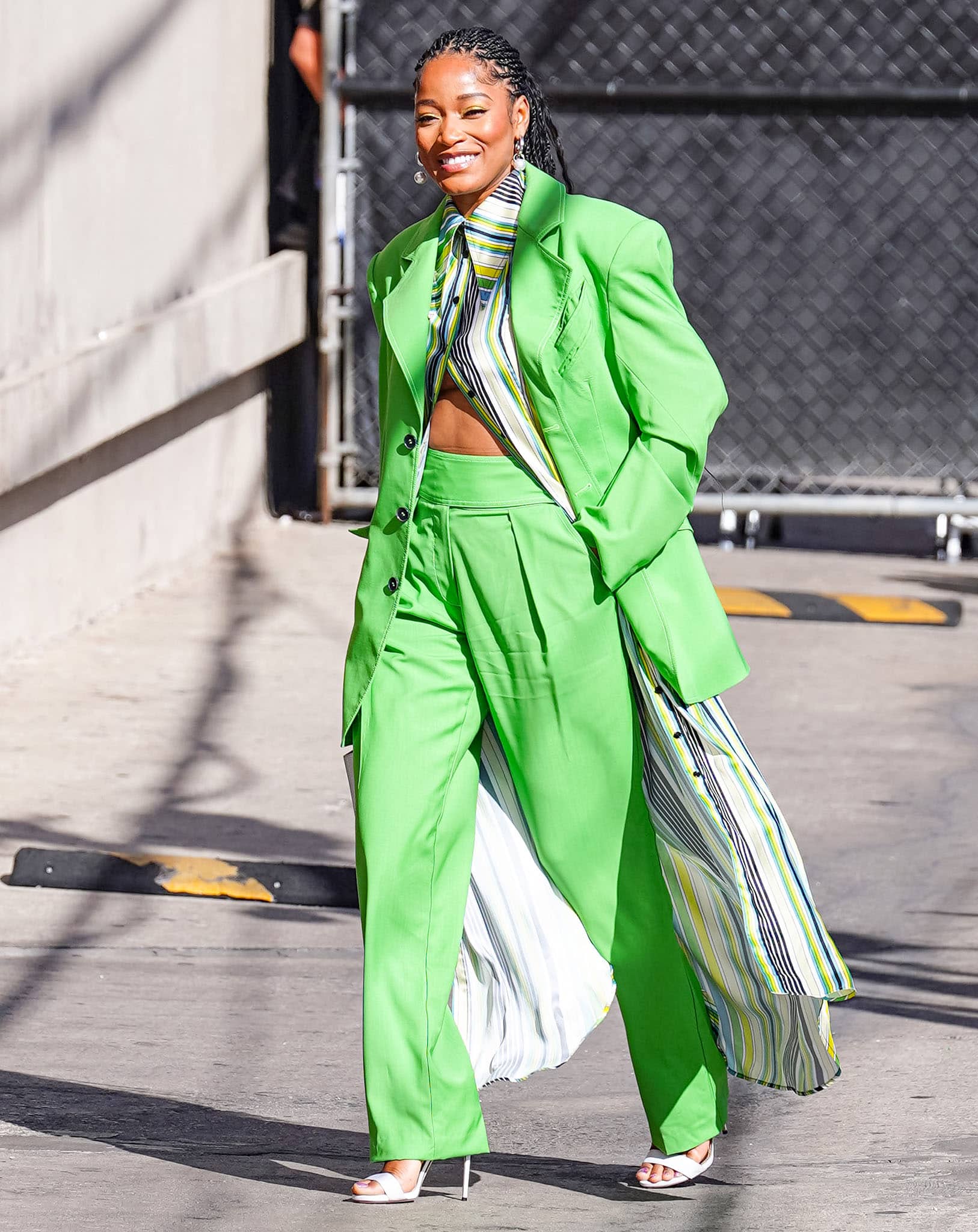 Keke Palmer can't be missed in a lime green Christopher John Rogers Resort 2022 suit for her Jimmy Kimmel Live! appearance on March 16, 2022