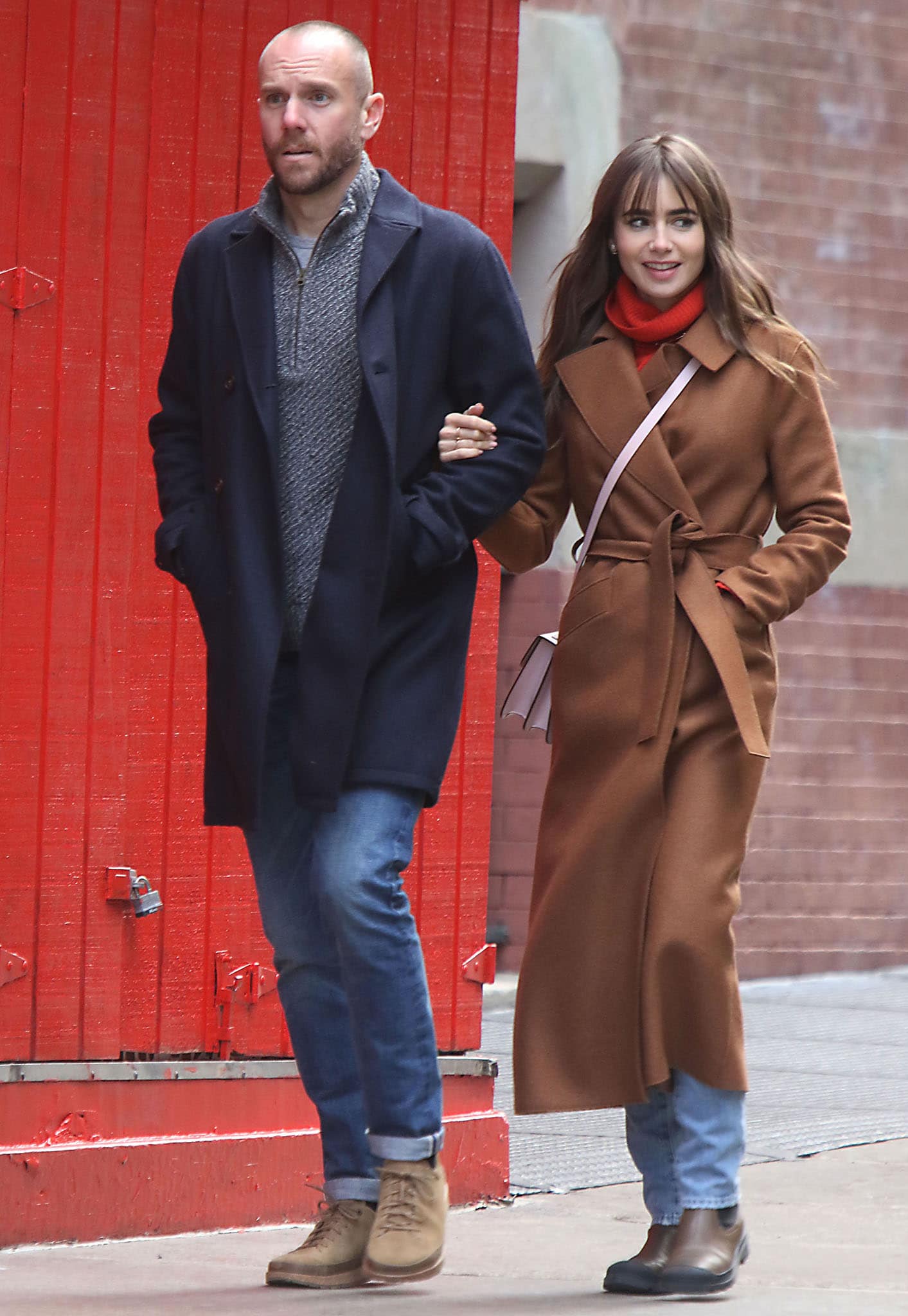 Lily Collins and Charlie McDowell stroll arm-in-arm around Soho on March 23, 2022