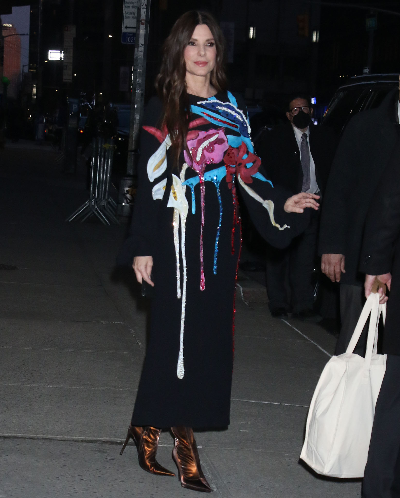 Sandra Bullock attends the New York premiere of The Lost City in Stella Jean black midi dress on March 14, 2022