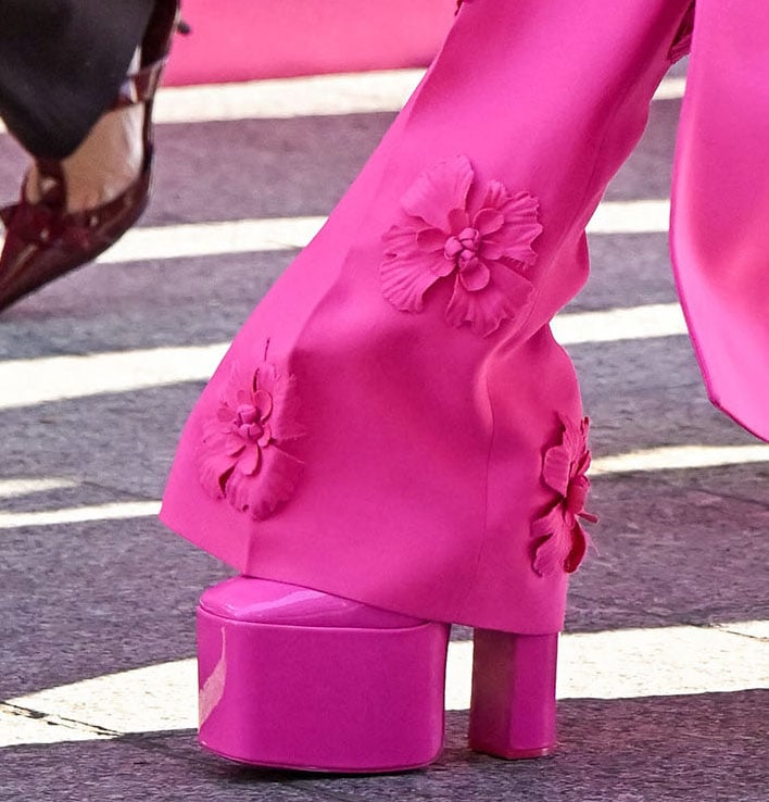 Zendaya adds several inches to her already tall 5'10" height with pink Valentino platform pumps