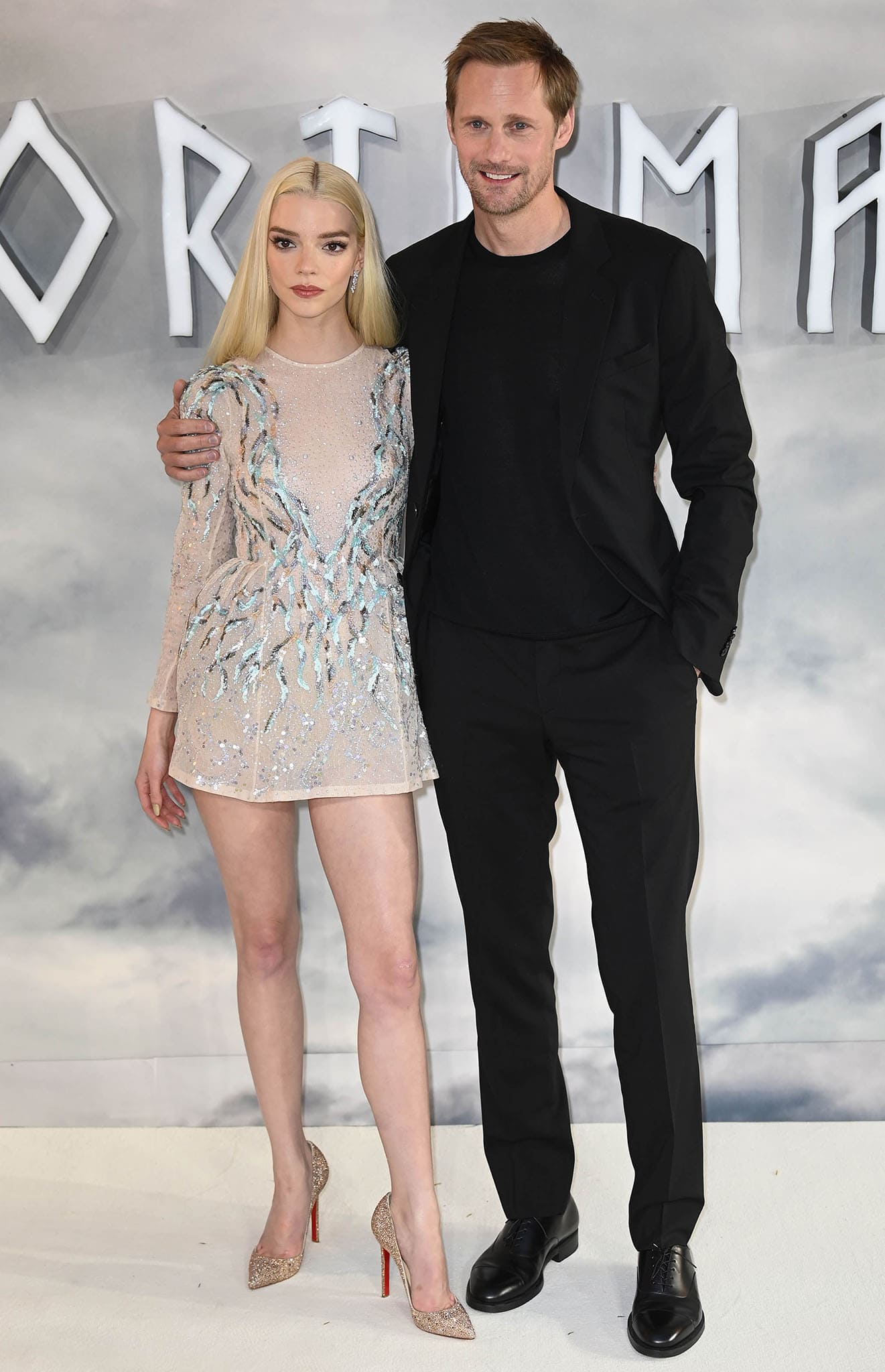 Anya Taylor-Joy and Alexander Skarsgard pose together at the London premiere of The Northman on April 5, 2022