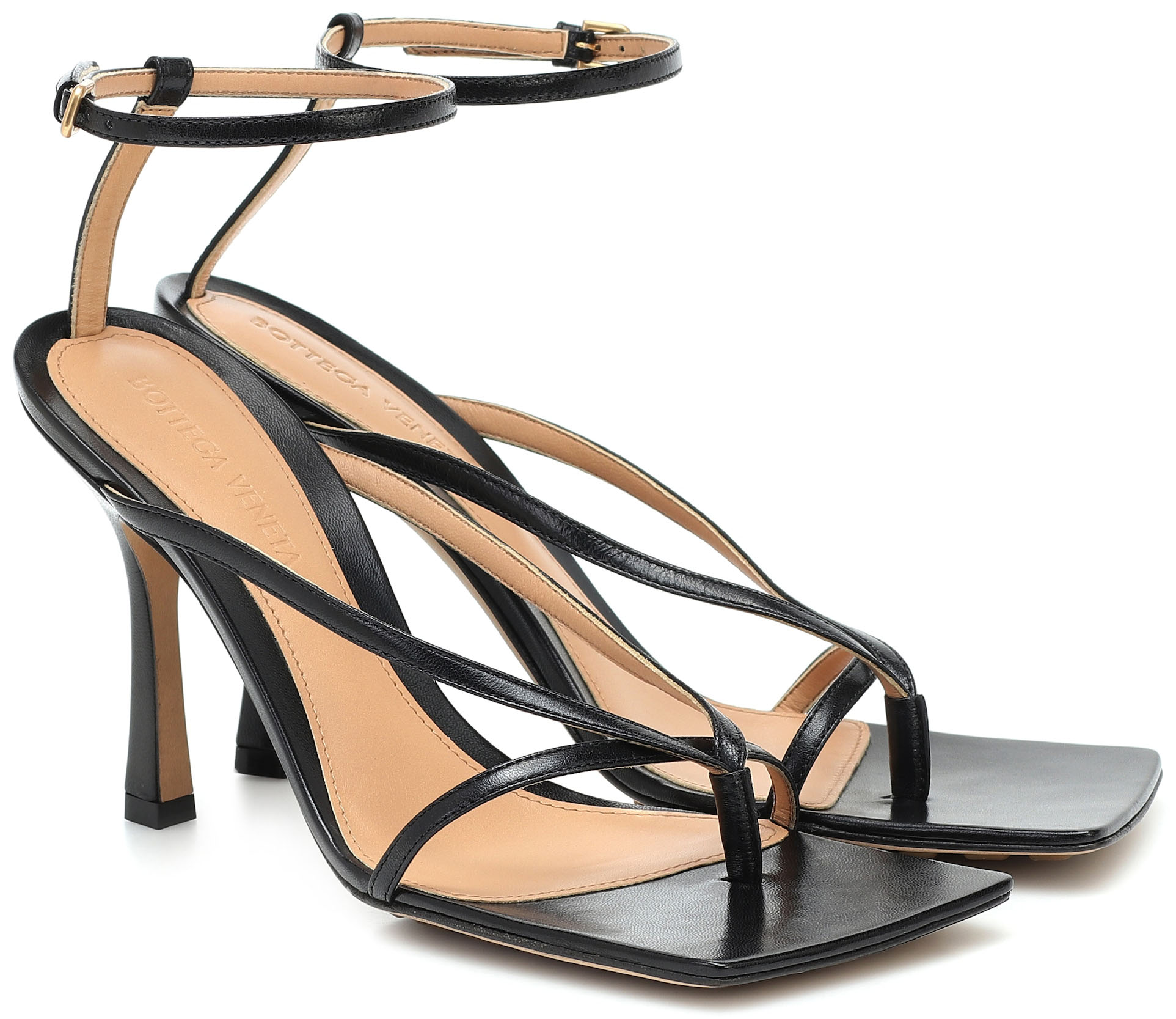 These sandals are molded to a modern square-toe silhouette and set upon sculpted heels