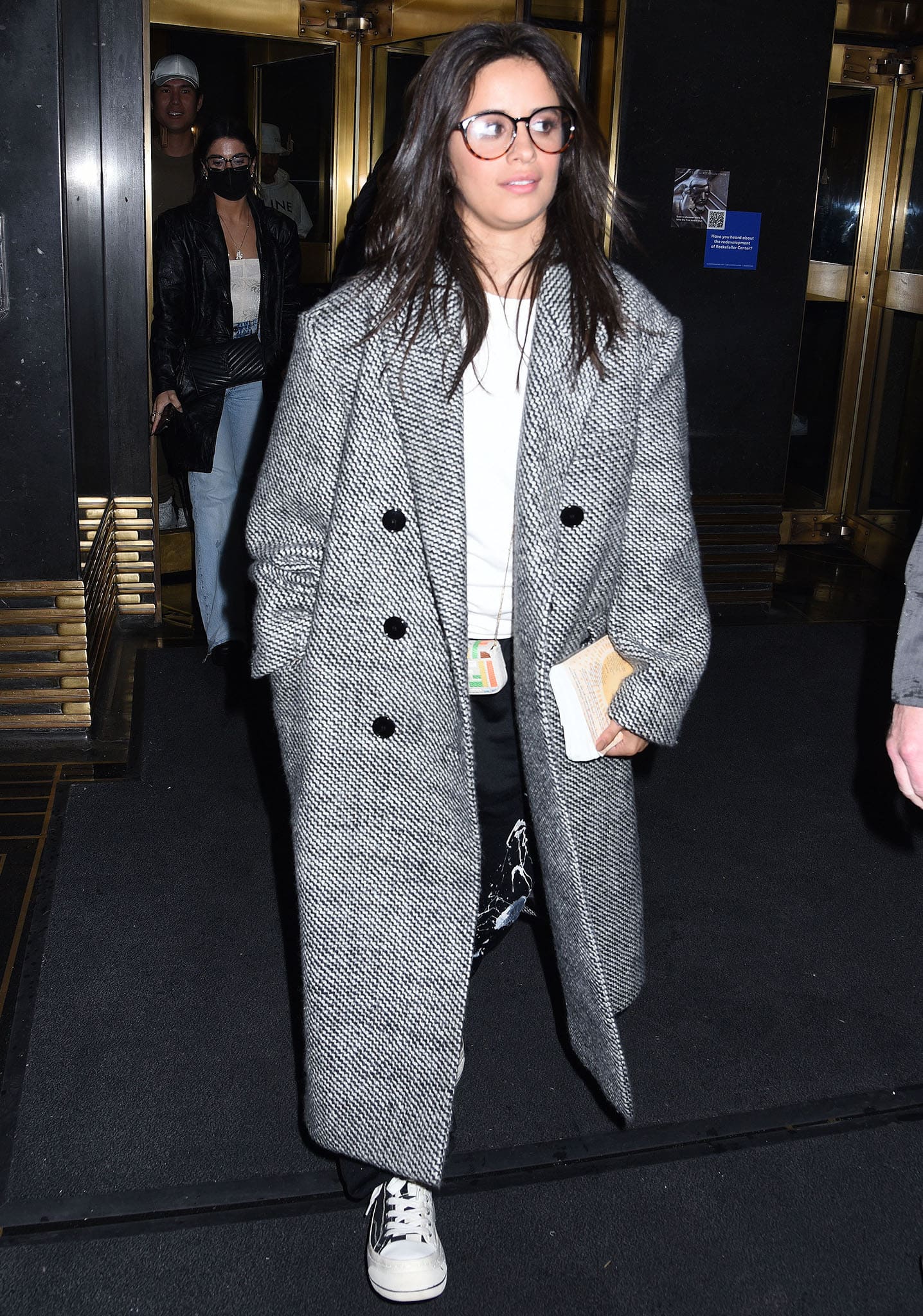 Camila Cabello heading to The Tonight Show Starring Jimmy Fallon in Balenciaga paint splatter track pants and a tweed coat