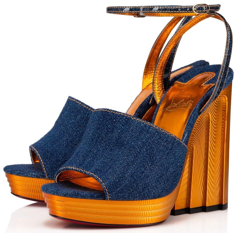 The Mira Colunata Girl sandal features a slim choker-style crossover ankle strap and an open-toed blue denim strap trimmed with a golden topstitch inspired by vintage Senegalese jewelry