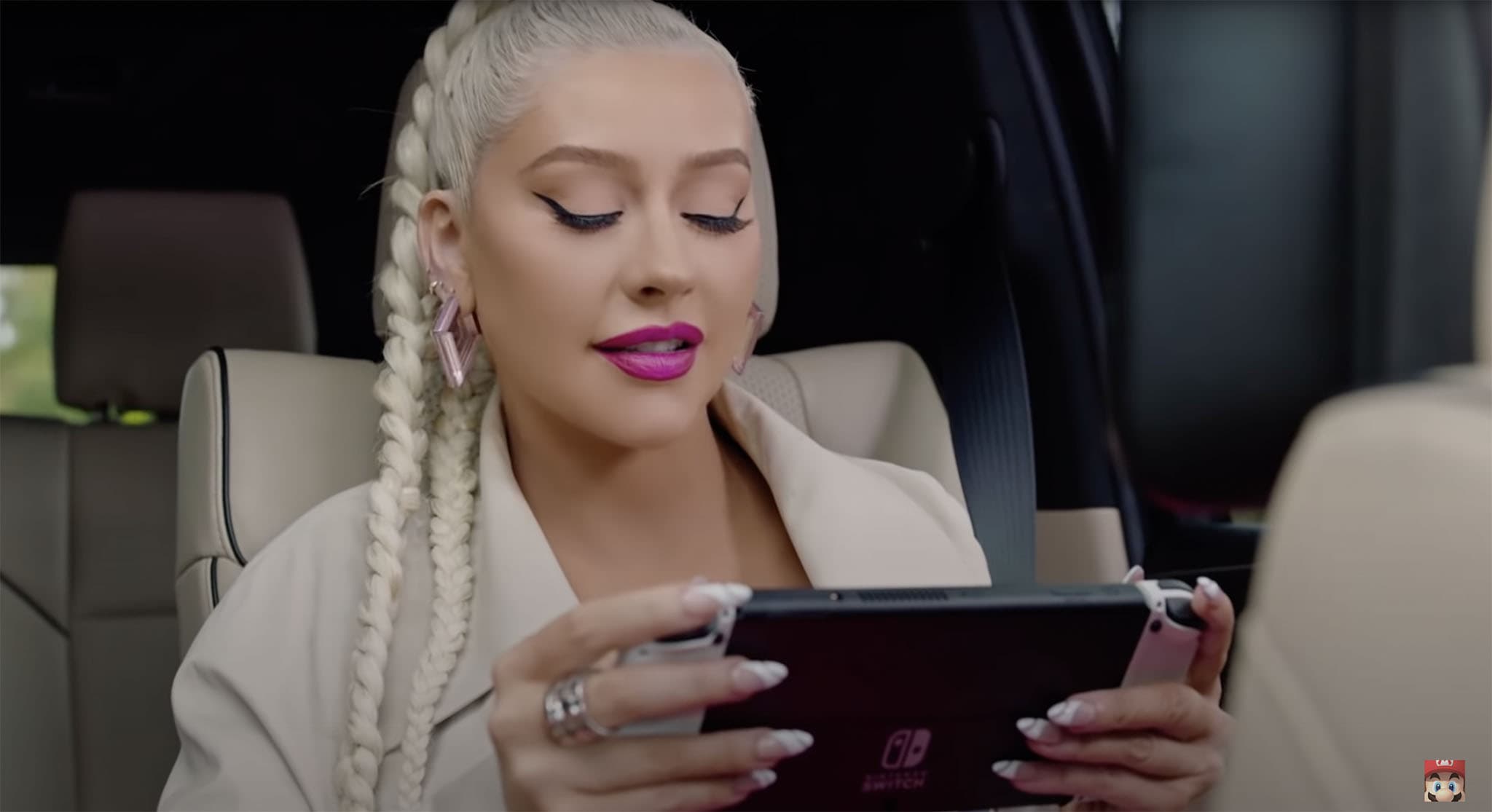 Christina Aguilera is seen playing Animal Crossing: New Horizons on her way home in the commercial