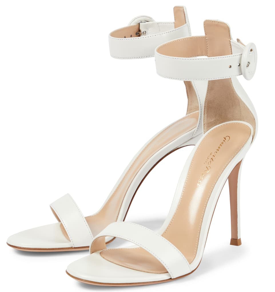 Gianvito Rossi's iconic Portofino sandals are made of lamb leather and feature round buckles and 4-inch pin heels