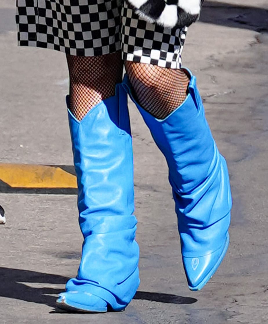 Gwen Stefani completes her look with fishnets and electric blue R13 Mid Cowboy boots