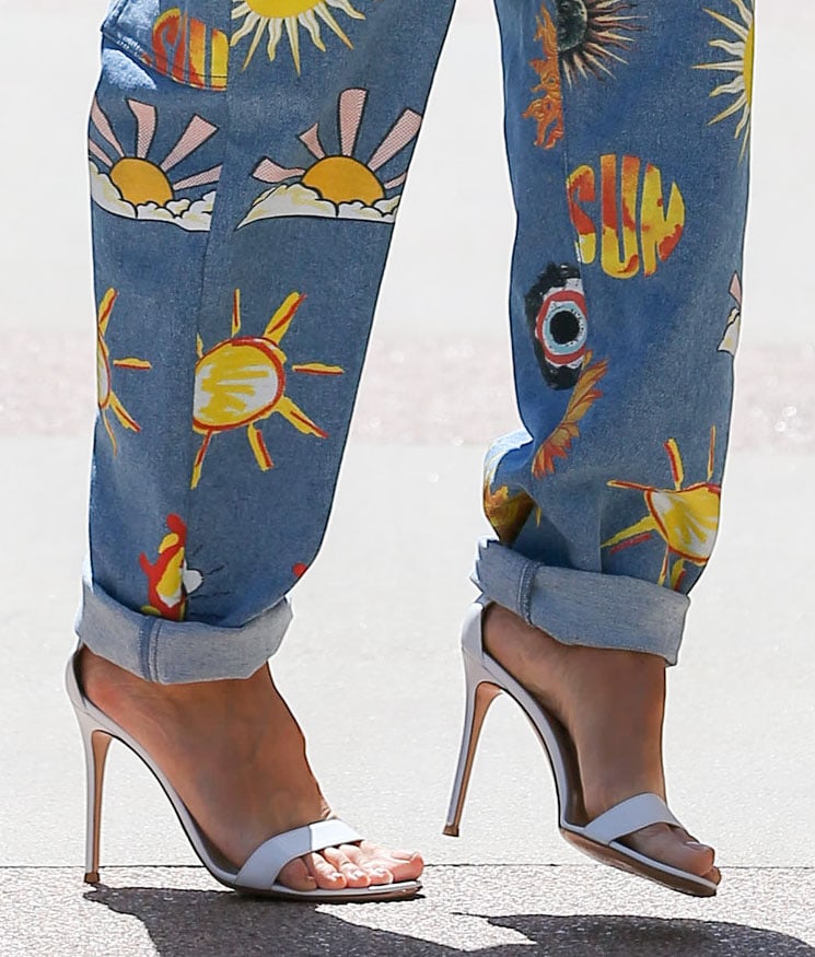 Heidi Klum completes her chic spring outfit by showing off her feet in Gianvito Rossi Portofino white heels