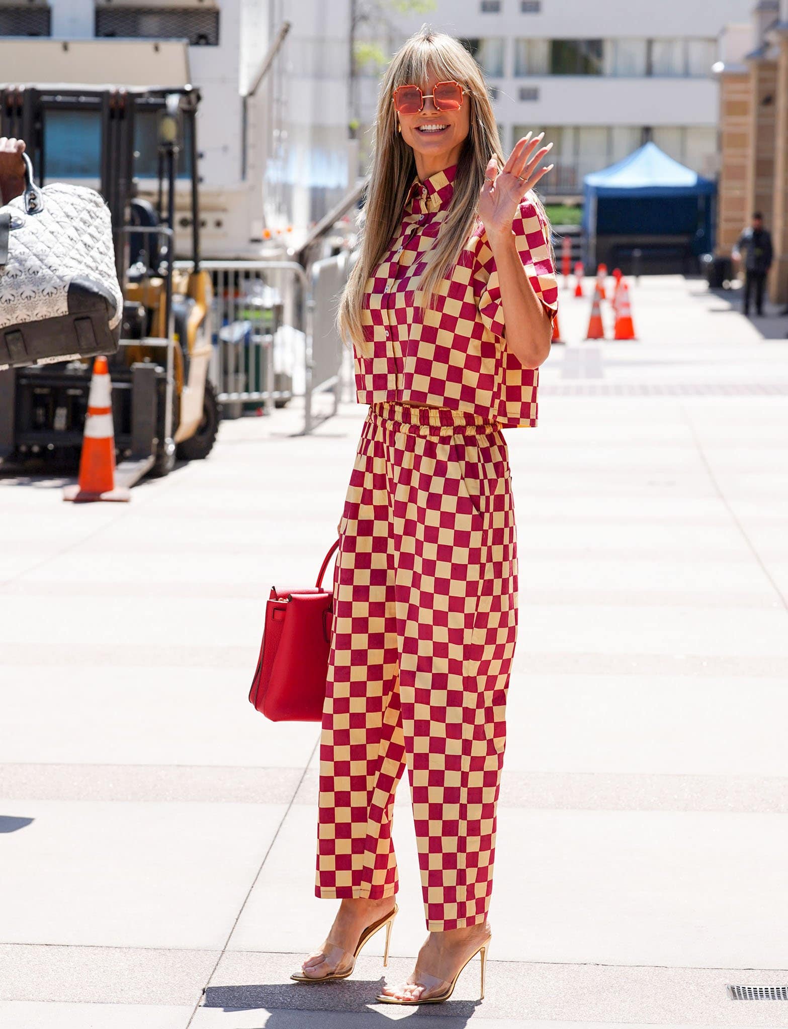 Heidi Klum channels '60s mod look in a red-and-cream checkerboard co-ord set on April 14, 2022