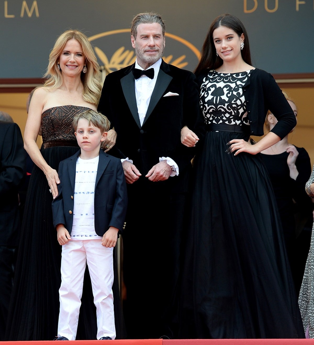 Kelly Preston (L) and John Travolta of "Gotti" pose with their children Ella Bleu Travolta (R) and Benjamin Travolta at the red carpet screening of "Solo: A Star Wars Story"