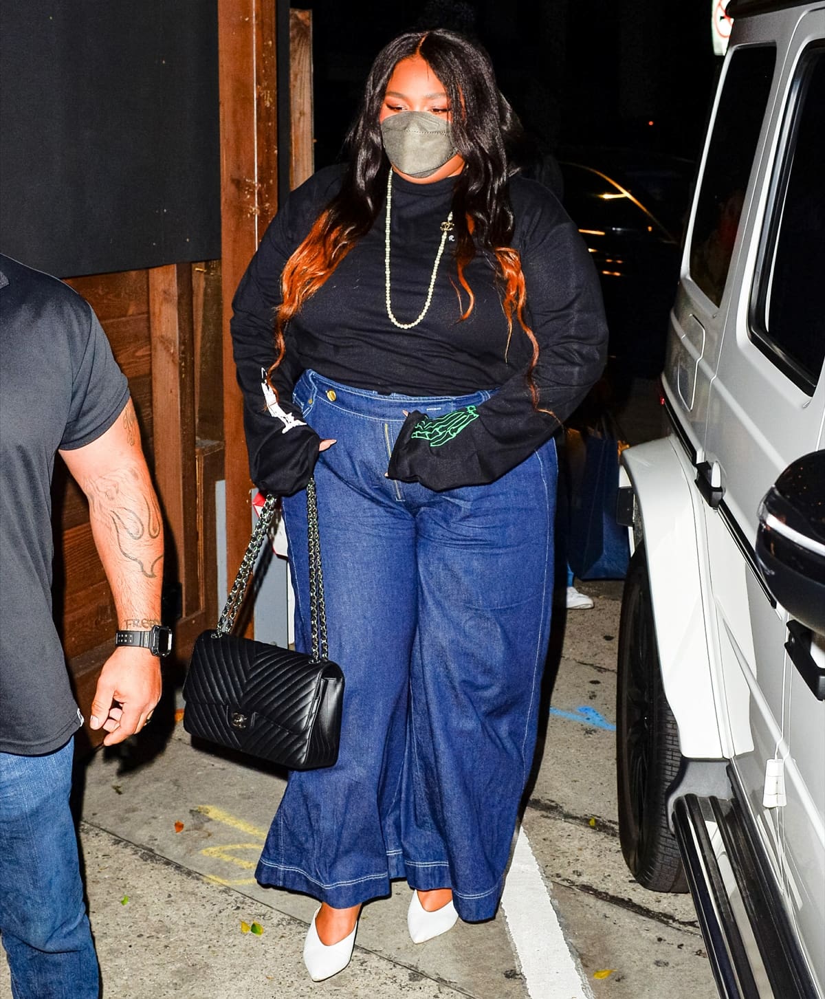Lizzo carries a Chanel handbag for dinner at celeb hotspot Craig’s restaurant