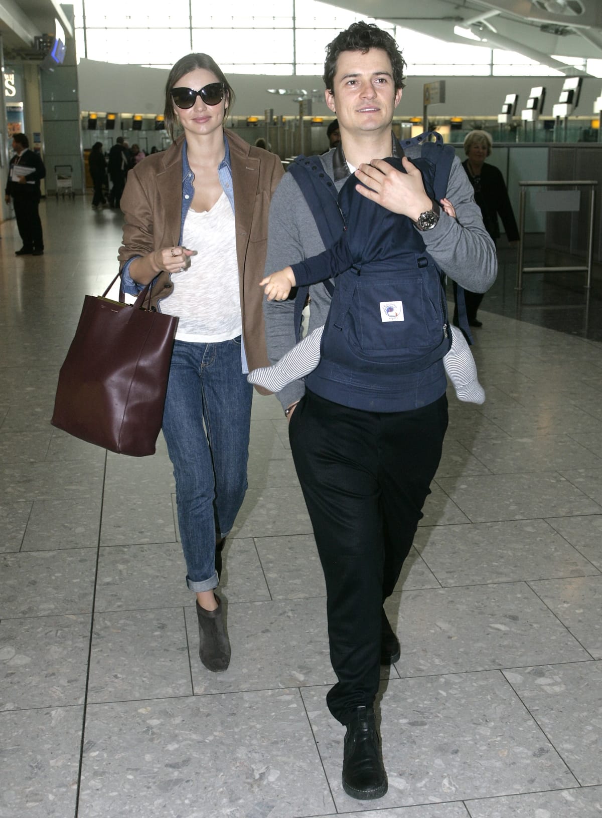 Miranda Kerr and hubby Orlando Bloom bring their son, Flynn, to Heathrow Airport