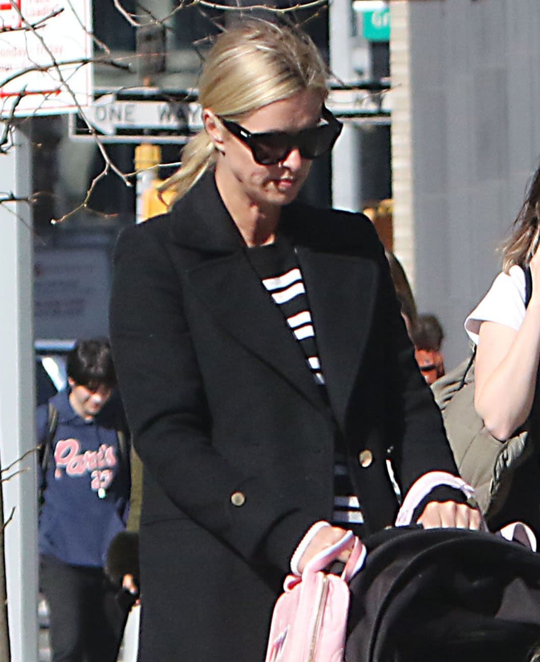 Nicky Hilton casually ties her blonde hair into a low ponytail and wears minimal makeup
