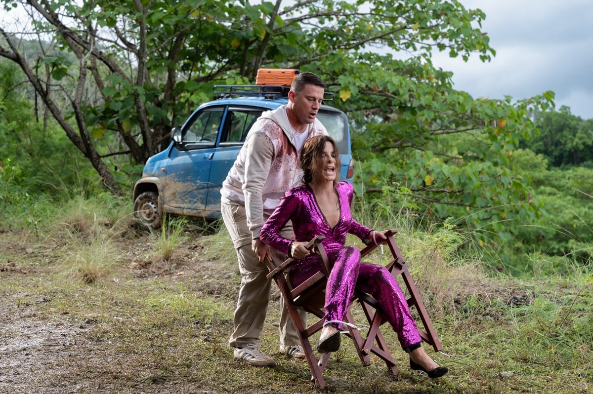 Sandra Bullock portrays a frustrated yet depressed best-selling romance novelist and Channing Tatum plays a dimwitted cover model in The Lost City, which is inspired by Romancing the Stone and The Jewel of the Nile