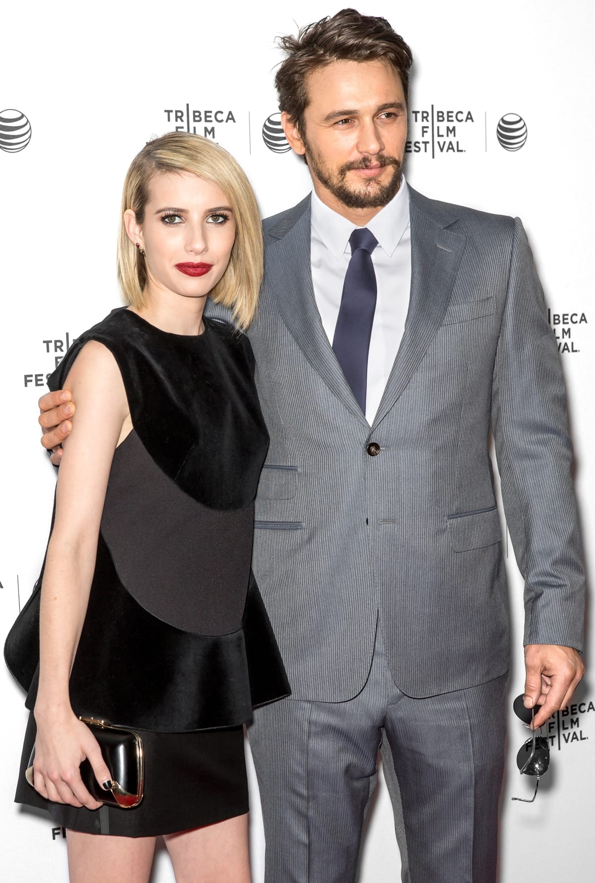Actor James Franco and actress Emma Roberts in a black Saint Laurent sequin dress arrive at Tribeca Film's 'Palo Alto'