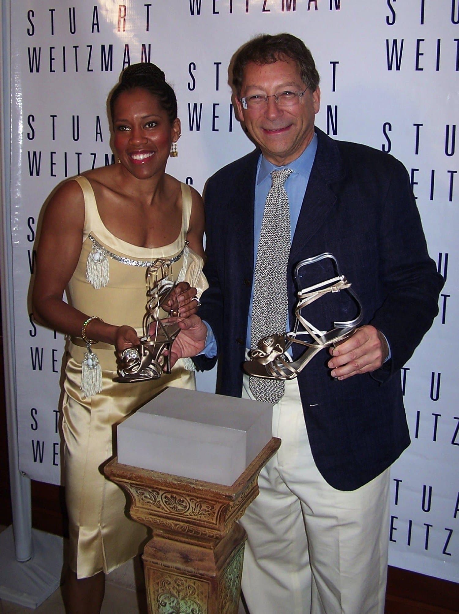 Actress Regina King and shoe designer Stuart Weitzman at the unveiling of the custom shoes (2 pieces of Marilyn Monroe's jewels embedded in the satin) that she would be wearing to the 2005 Academy Awards