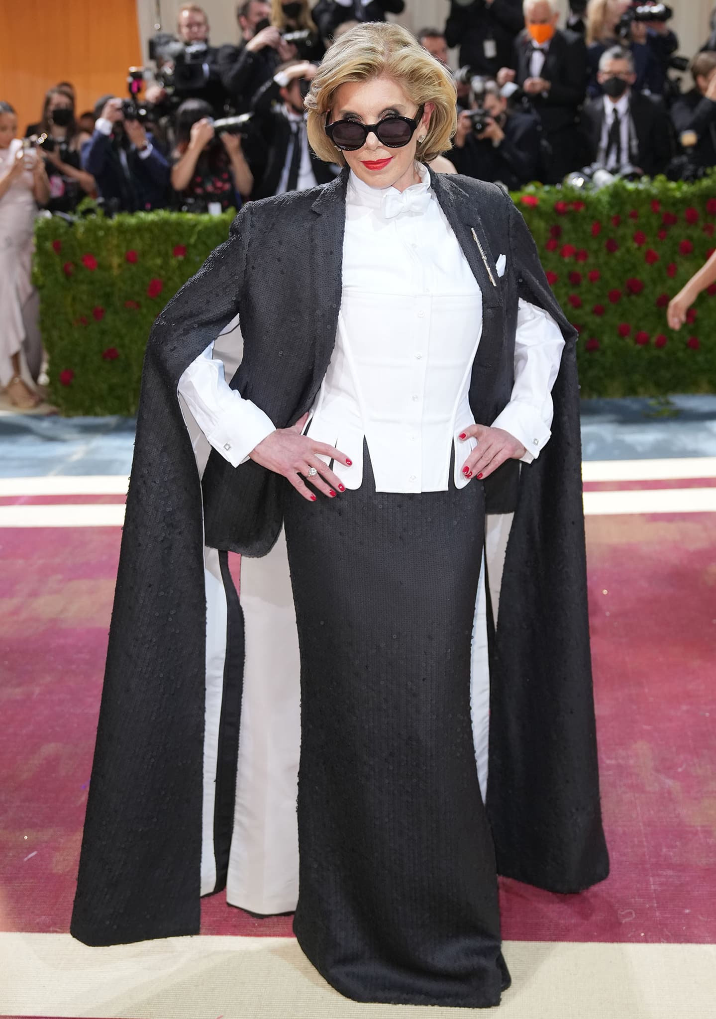 Christine Baranski in Thom Browne's white pique corset, matte black sequined cape jacket, and matching skirt