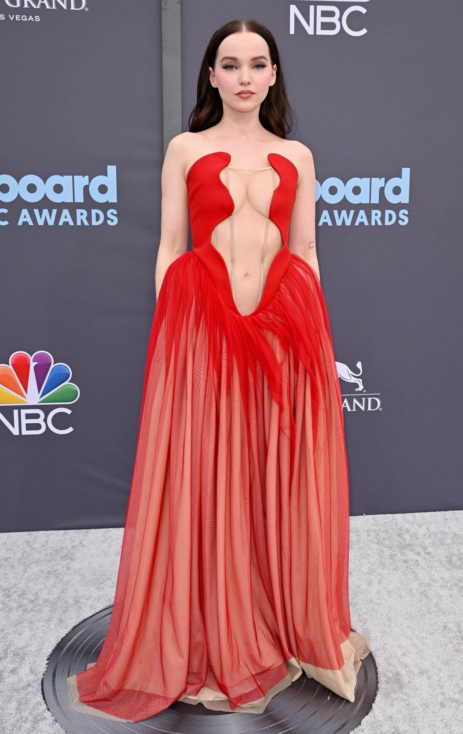 Dove Cameron flaunts her boobs in an Ashlyn gown at the 2022 Billboard Music Awards