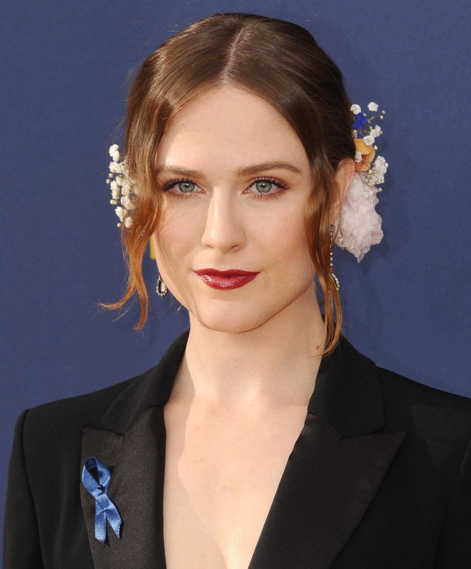 Evan Rachel Wood decorated her low bun with fresh flowers at the 70th Emmy Awards