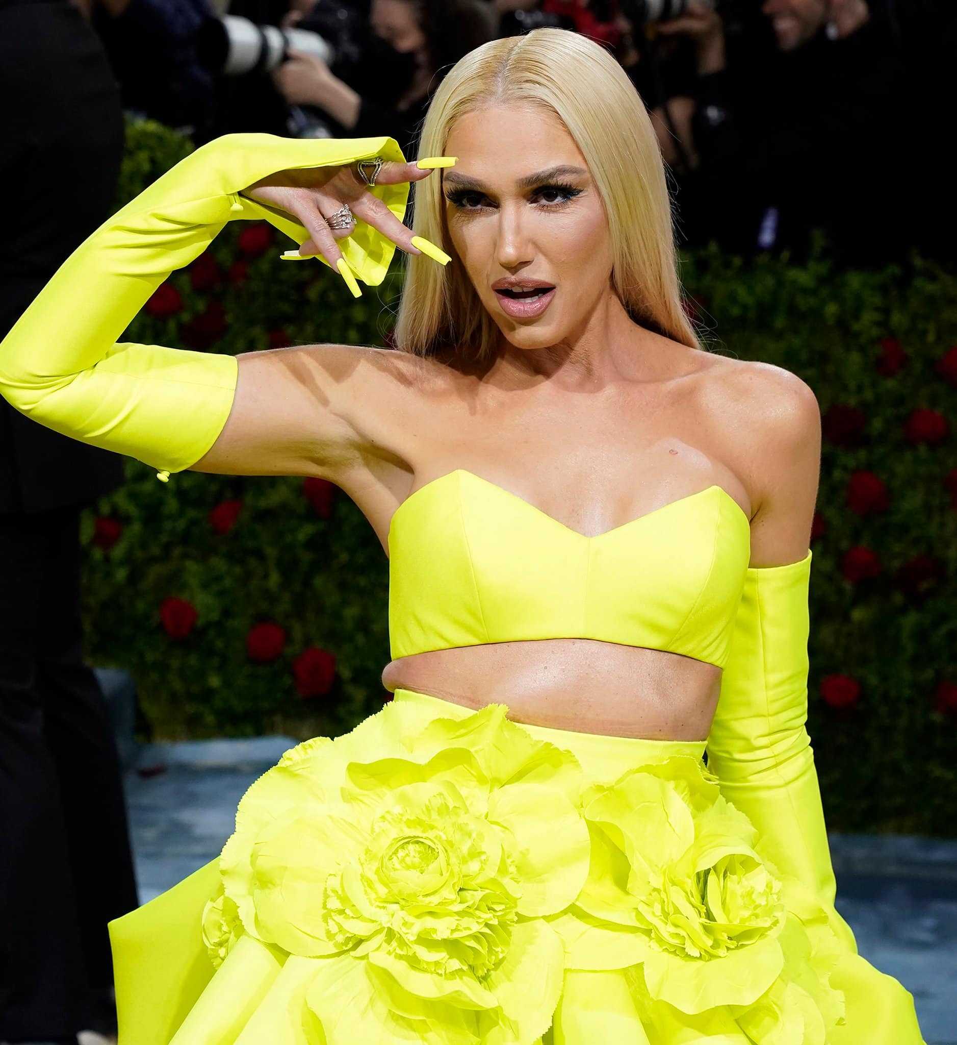 Gwen Stefani pairs her neon gown with neon acrylic nails and electric blue eyeliner