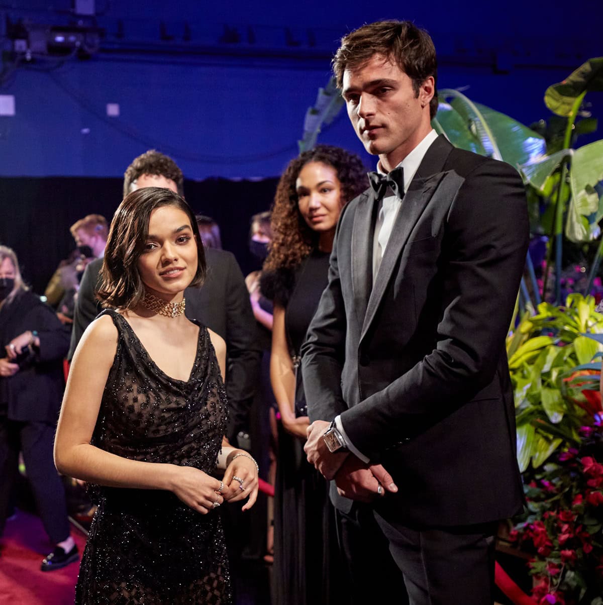 Jacob Elordi (6ft 5/195.6 cm, US shoe size 13) towers over his petite co-presenter Rachel Zegler (5ft 2/157.5 cm) backstage at the 94th Academy Awards, where she stunned in a sheer black Dior Haute Couture gown with Tiffany & Co. jewels
