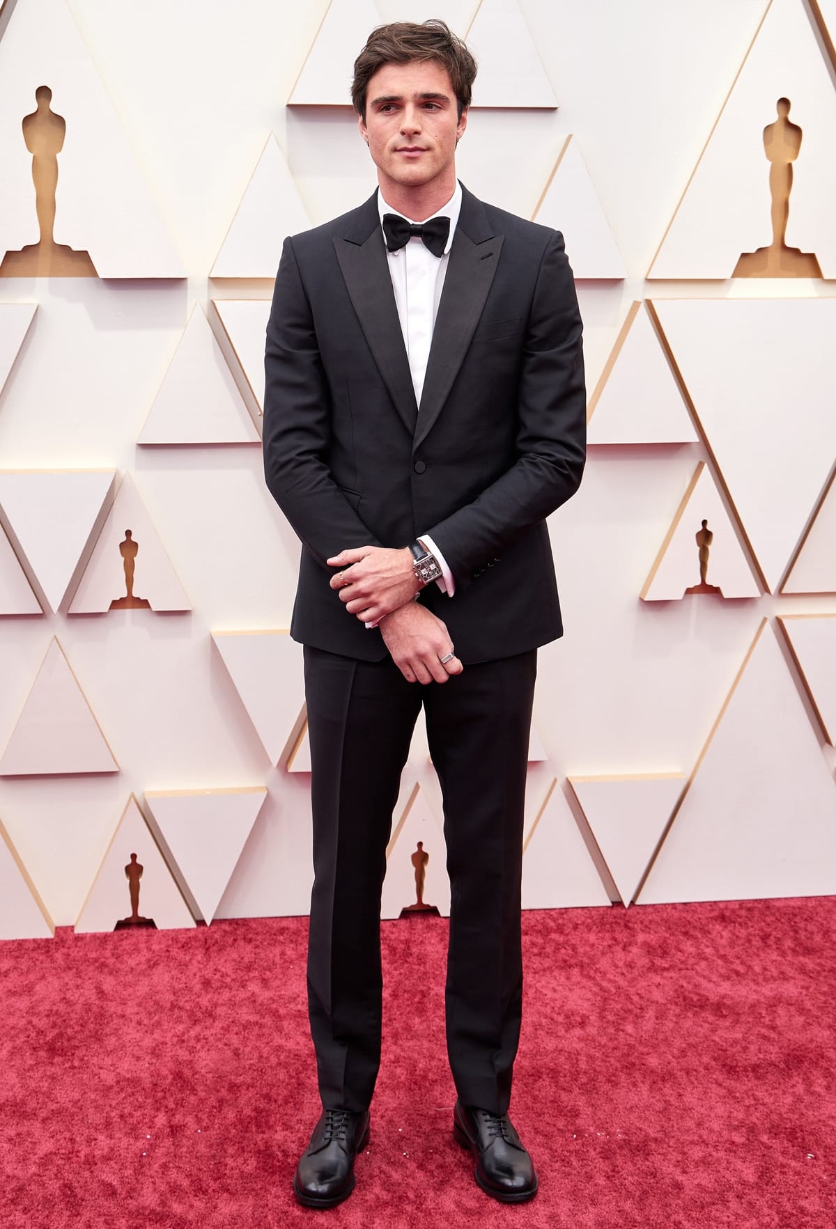 Jacob Elordi wearing Burberry with David Yurman jewelry and a TAG Heuer watch a the 94th Annual Academy Awards