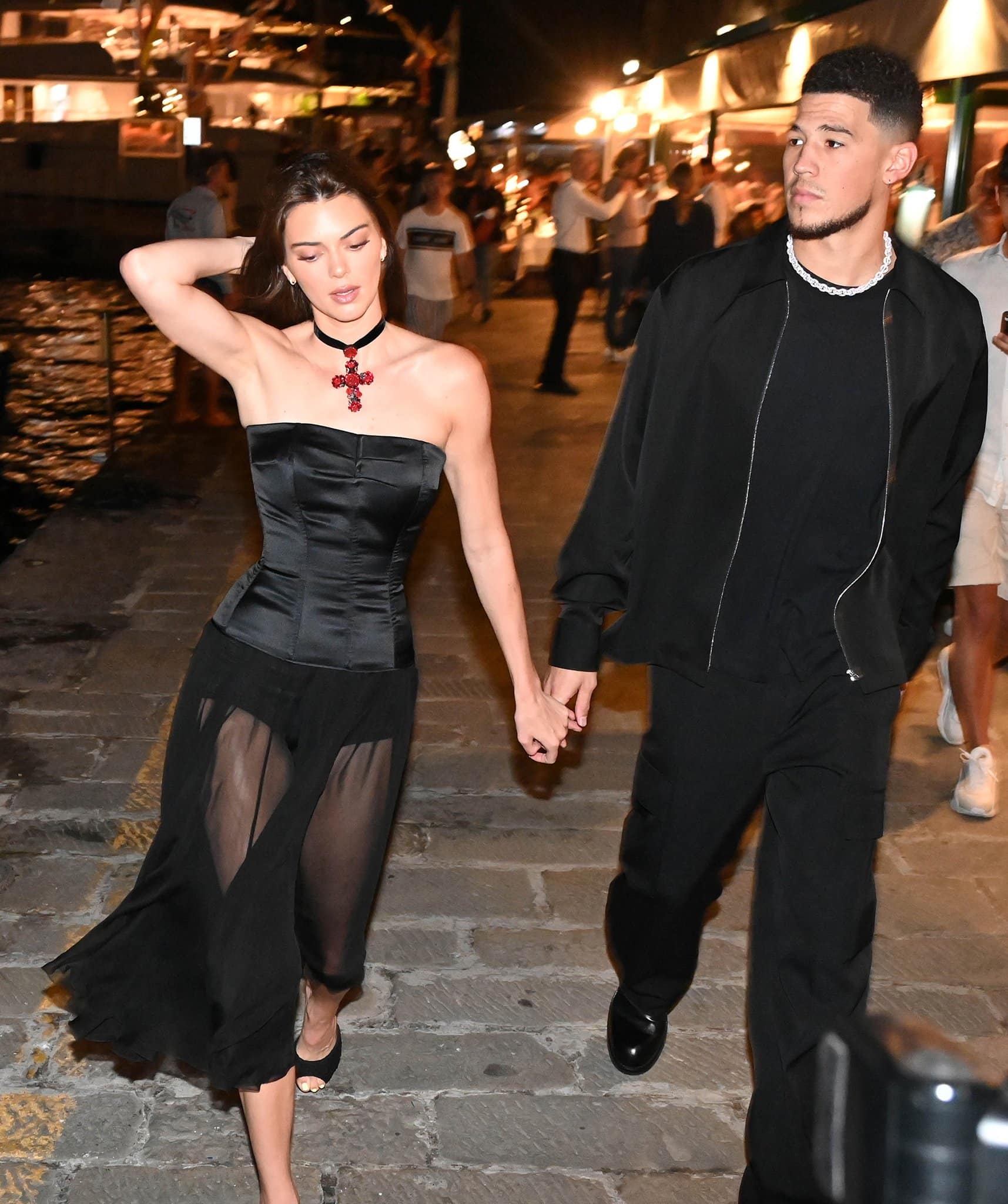 Kendall Jenner displays her model legs in D&G 1995 sheer black dress with Devin Booker in coordinating black ensemble