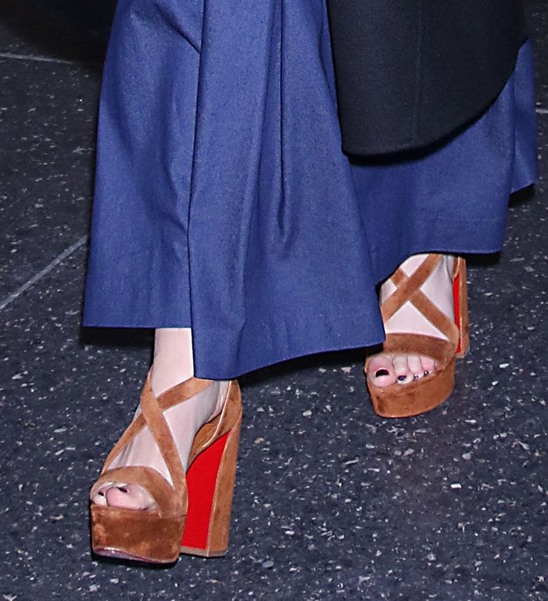 Kiernan Shipka displays her feet in Christian Louboutin Movida brown suede platform sandals
