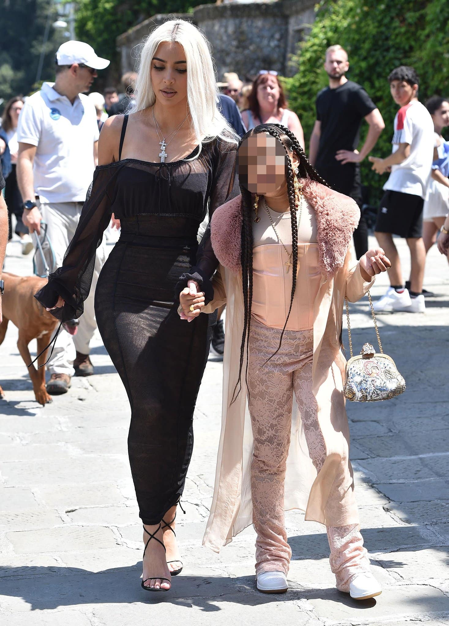 Kim Kardashian showcases her hourglass figure in an archival sheer black maxi dress