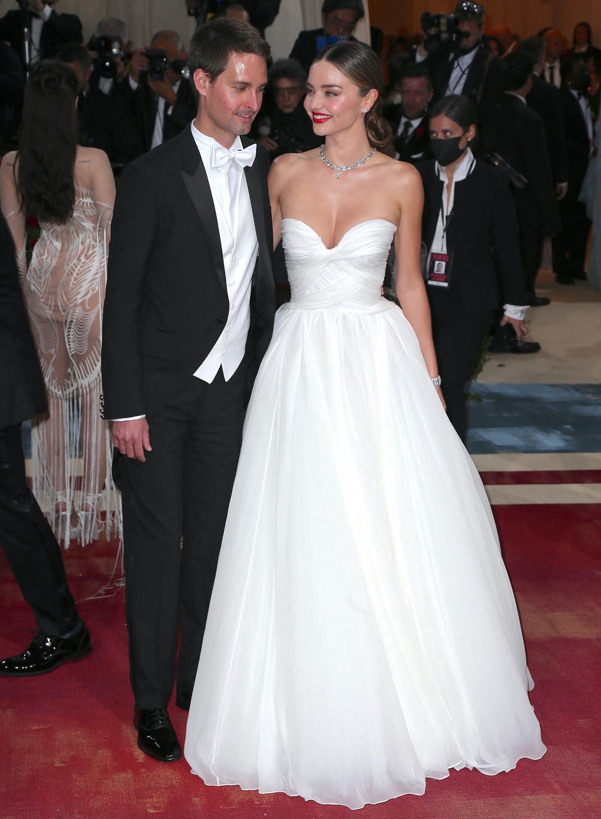 Miranda Kerr in a custom Oscar de la Renta strapless dress styled with Bvlgari jewelry and her husband Evan Spiegel hit the red carpet together at the 2022 Met Gala