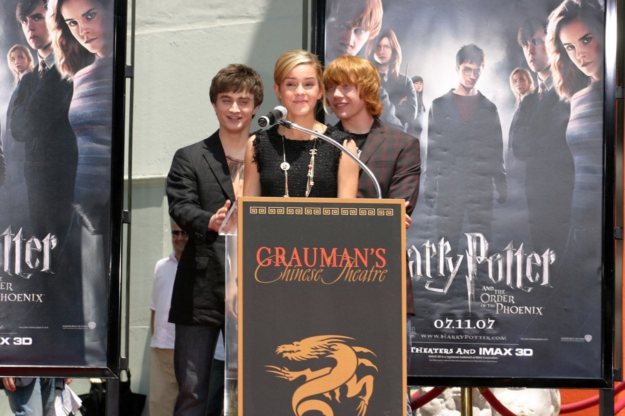 Rupert Grint, Daniel Radcliffe, and Emma Watson at the Hand, Foot, and Wand-Print Ceremony at Grauman