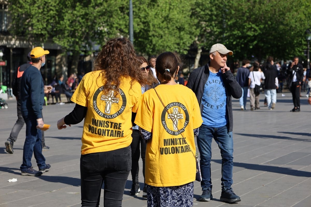 Scientology members prospecting and recruiting people to their religious cult in the streets of Paris