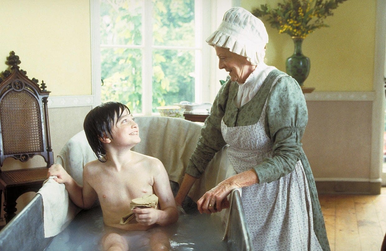 Maggie Smith as Betsey Trotwood and Daniel Radcliffe as David Copperfield in the 1999 BBC television drama adaptation of Charles Dickens's 1850 novel David Copperfield