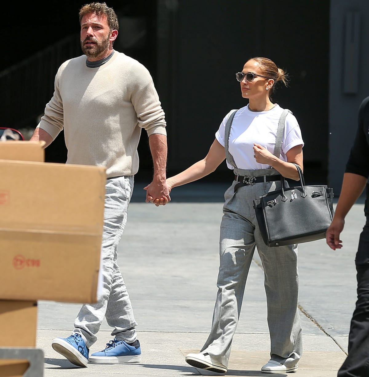 Ben Affleck and Jennifer Lopez holding hands outside the RED Studios in Hollywood