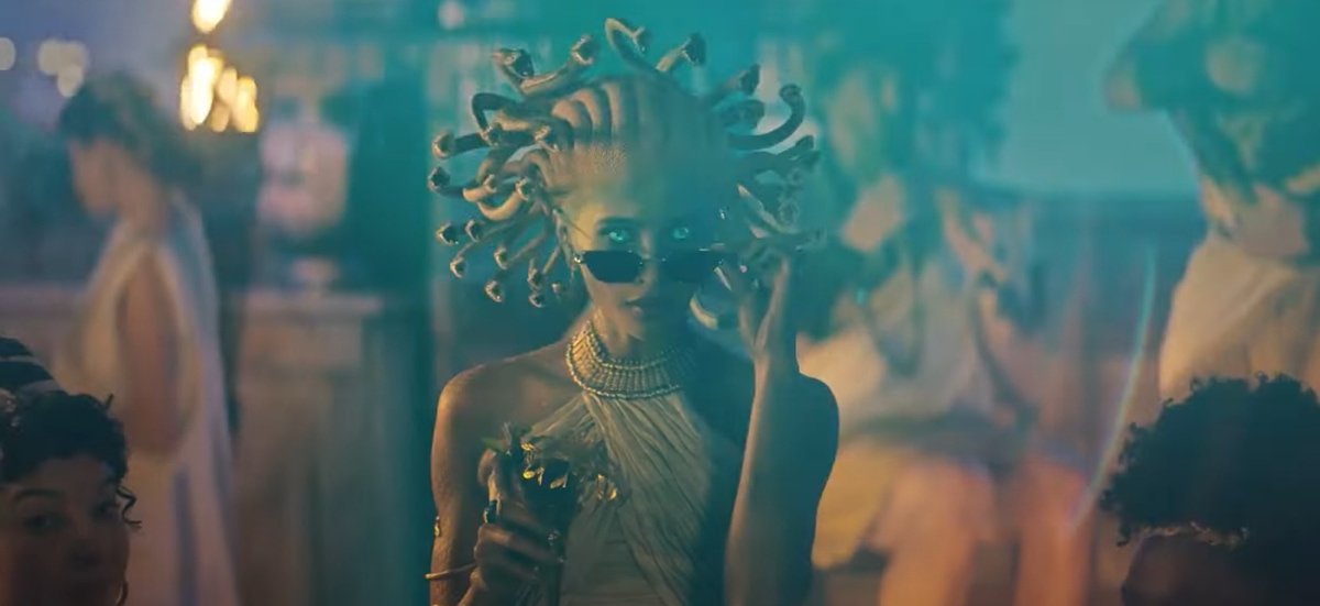 Jesi Le Rae as Medusa takes off her sunglasses to turn a man into stone in Amazon’s Prime commercial