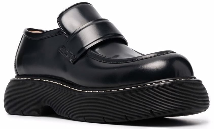 The Bounce loafers by Bottega Veneta boast a chunky silhouette with contrast white stitching