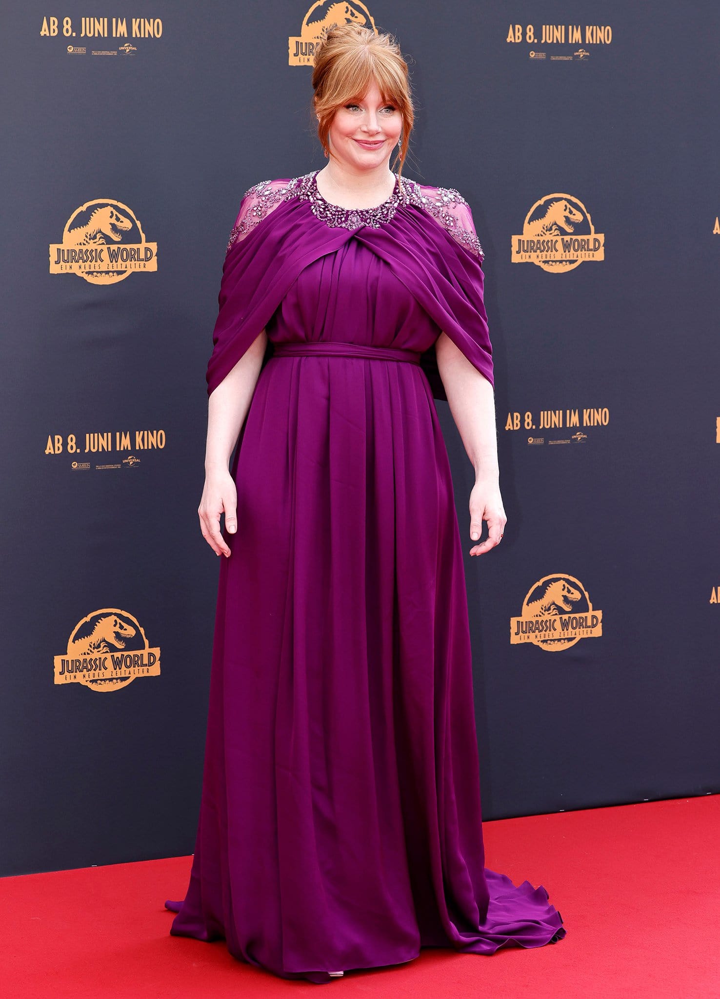 Bryce Dallas Howard looks regal in a Pamella Roland plum gown at the Germany premiere of Jurassic World: Dominion on May 30, 2022