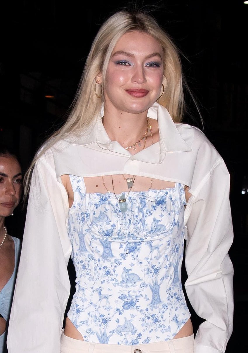 Gigi Hadid coordinates her swimsuit with her glittery blue eyeshadow