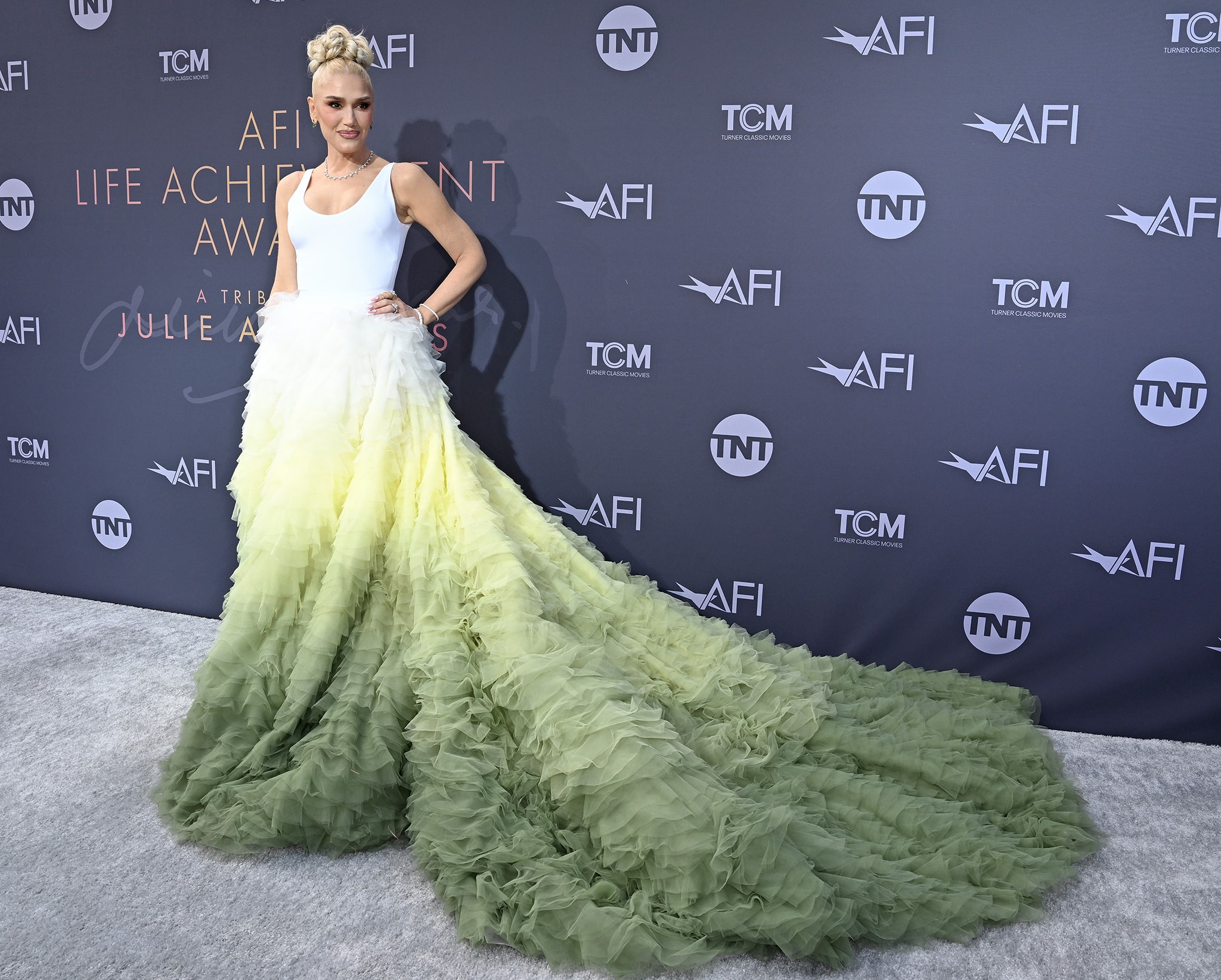 Gwen Stefani wows in a Nicole + Felicia Fall 2022 green ombre gown with a massive train