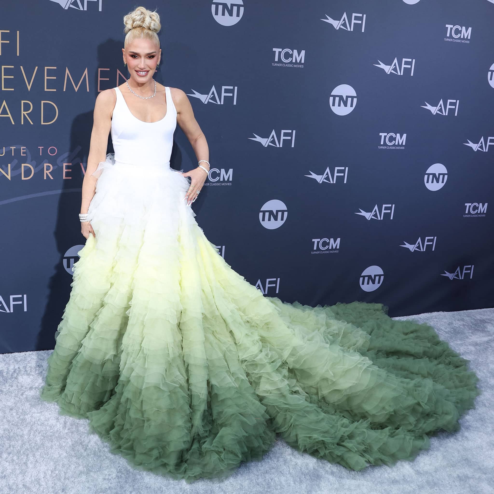 Gwen Stefani fangirls over Julie Andrews in the scene-stealing gown that features a white tank-style bodice and a voluminous ruffled skirt