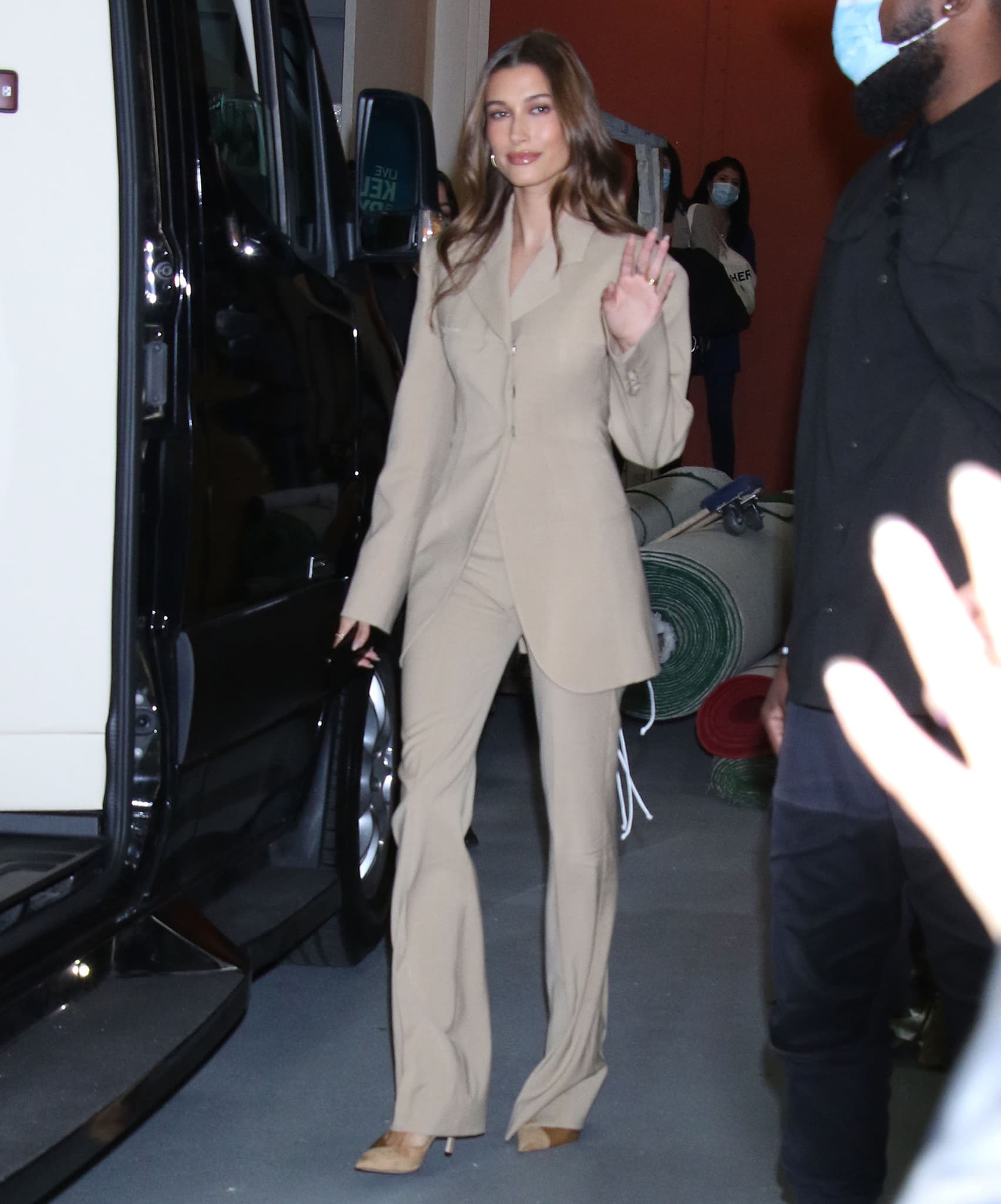 Hailey Bieber drops by Live with Kelly and Ryan in a beige Sportmax pantsuit