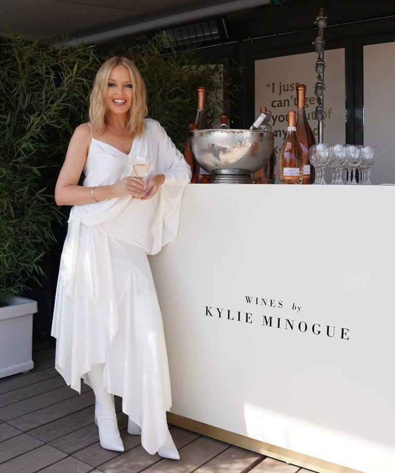Kylie Minogue Brings Her Popular Rosé Wines to America in Snake Dress