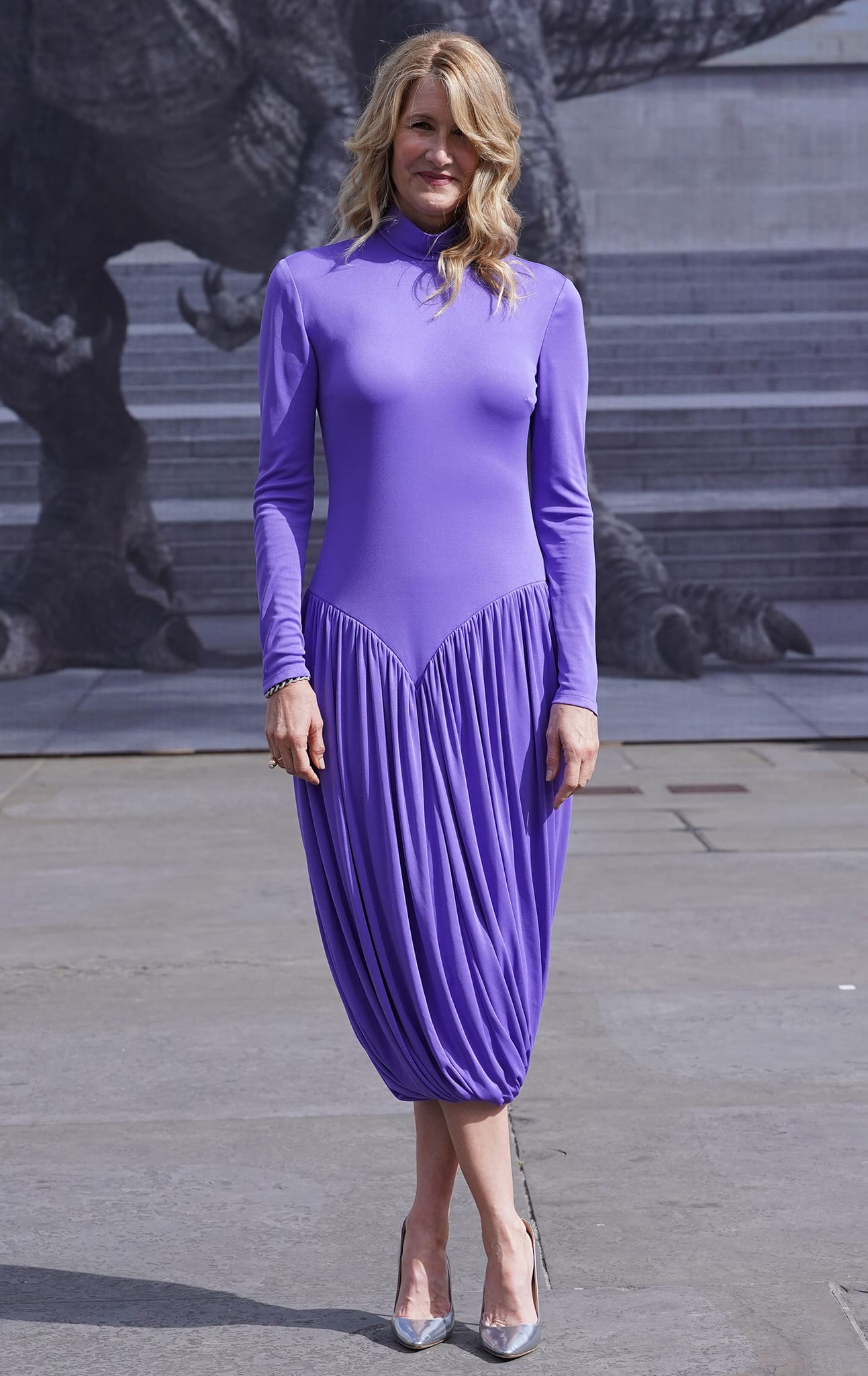 Laura Dern stands out in a purple Stella McCartney slinky, draped dress at the London photocall on May 27, 2022