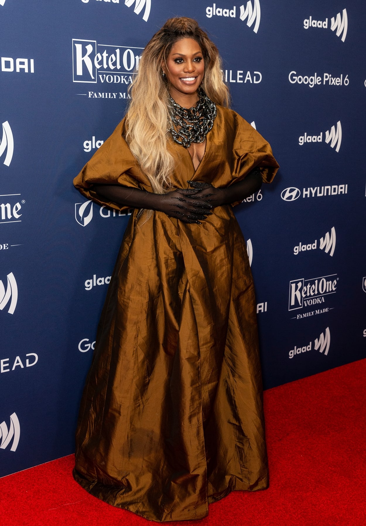 Laverne Cox in a brown Marmar Halim dress and a massive necklace from the same Egyptian Semi-Couture designer