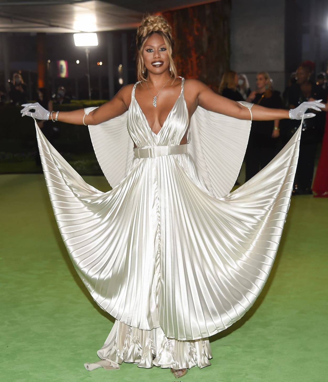Laverne Cox in a custom-made Johanna Johnson cape with silver Beladora jewelry and glittering Garo Sparo gloves at The Academy Museum of Motion Pictures Opening Gala