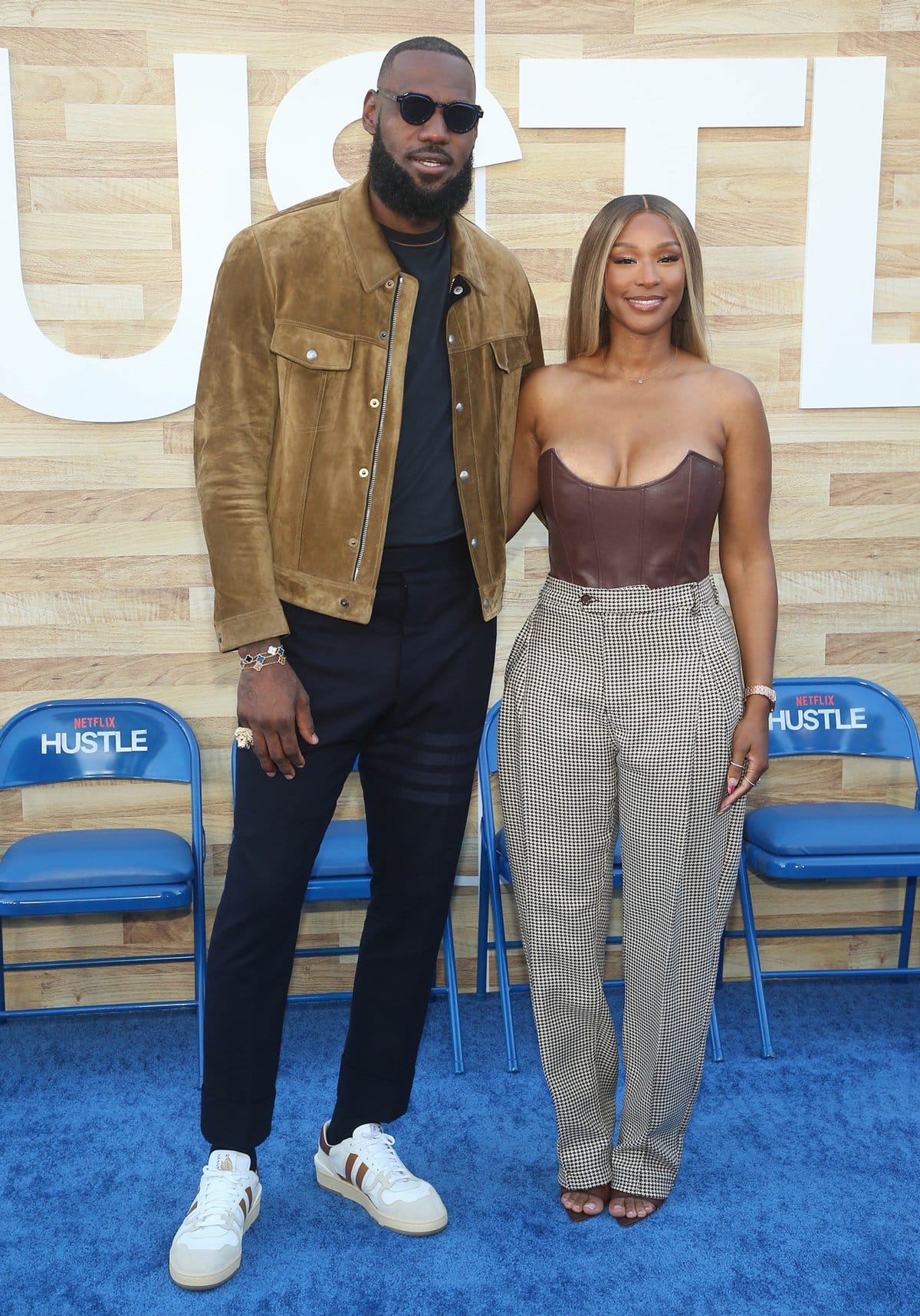 LeBron James and his wife Savannah James attend the Netflix World Premiere of "Hustle"