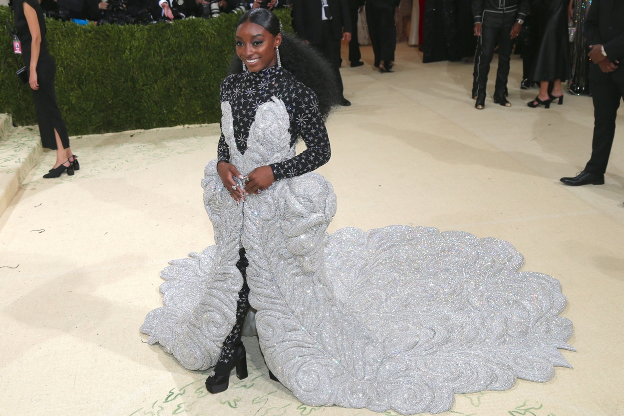 Simone Biles in a silver AREA x Athleta dress covered in Swarovski crystals at the 2021 Costume Institute Benefit - In America: A Lexicon of Fashion at the Metropolitan Museum of Art